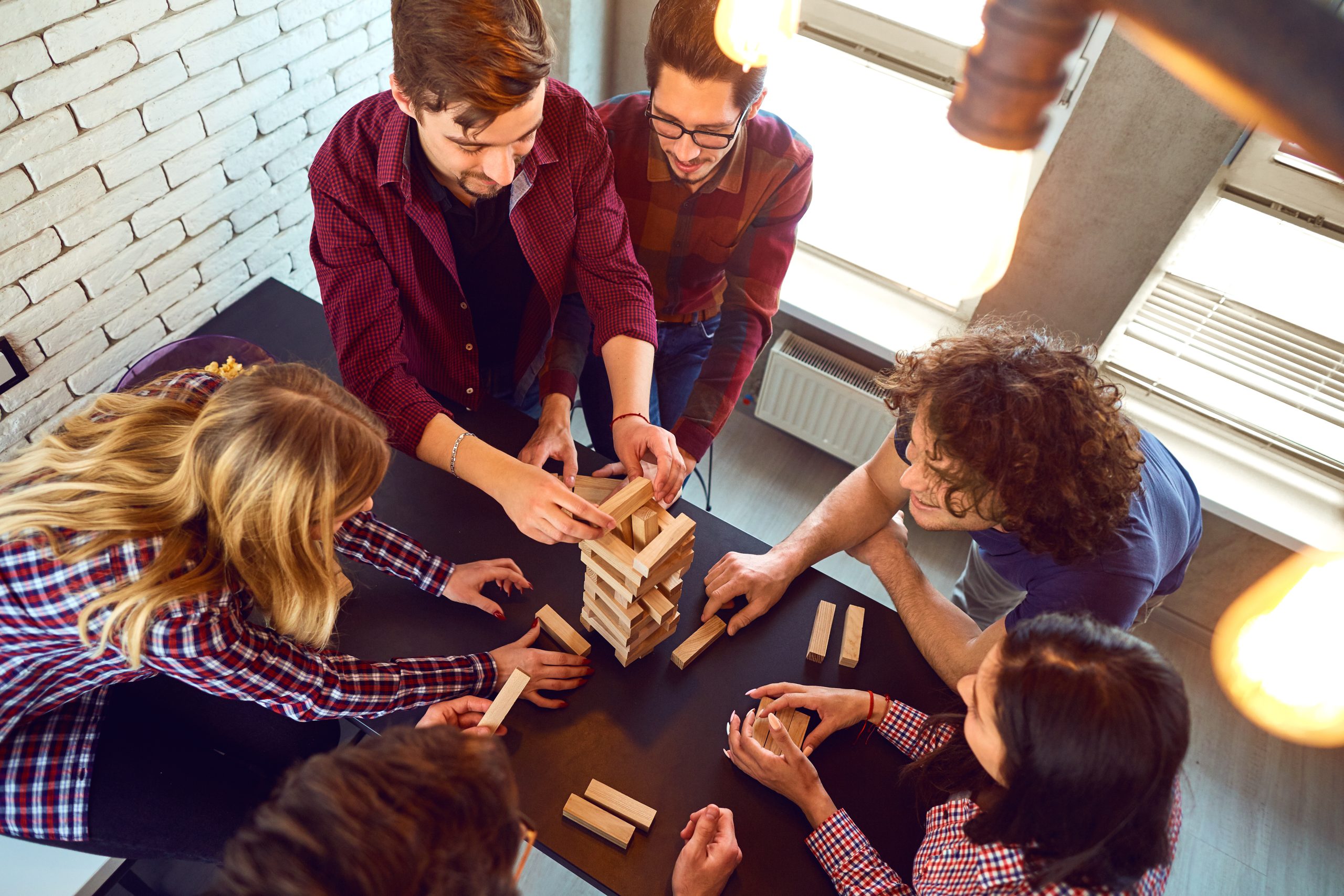 Top view friends play indoor board games